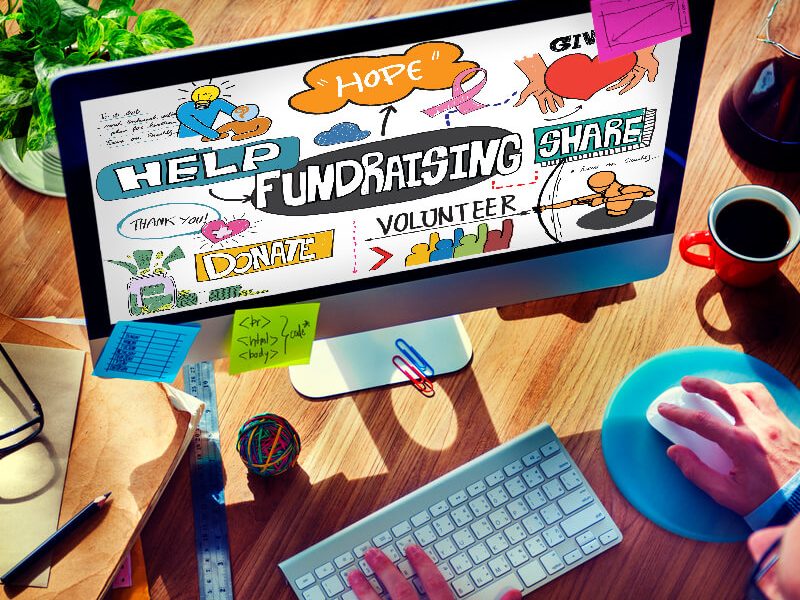 a computer monitor is filled with words like fundraising, support, donate